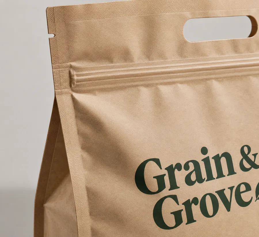 Printed carry-out pouch detail showing its zipper and clean gusset grip