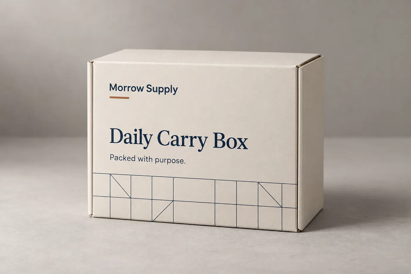 Closed ivory folding product box with navy geometric print and copper accent