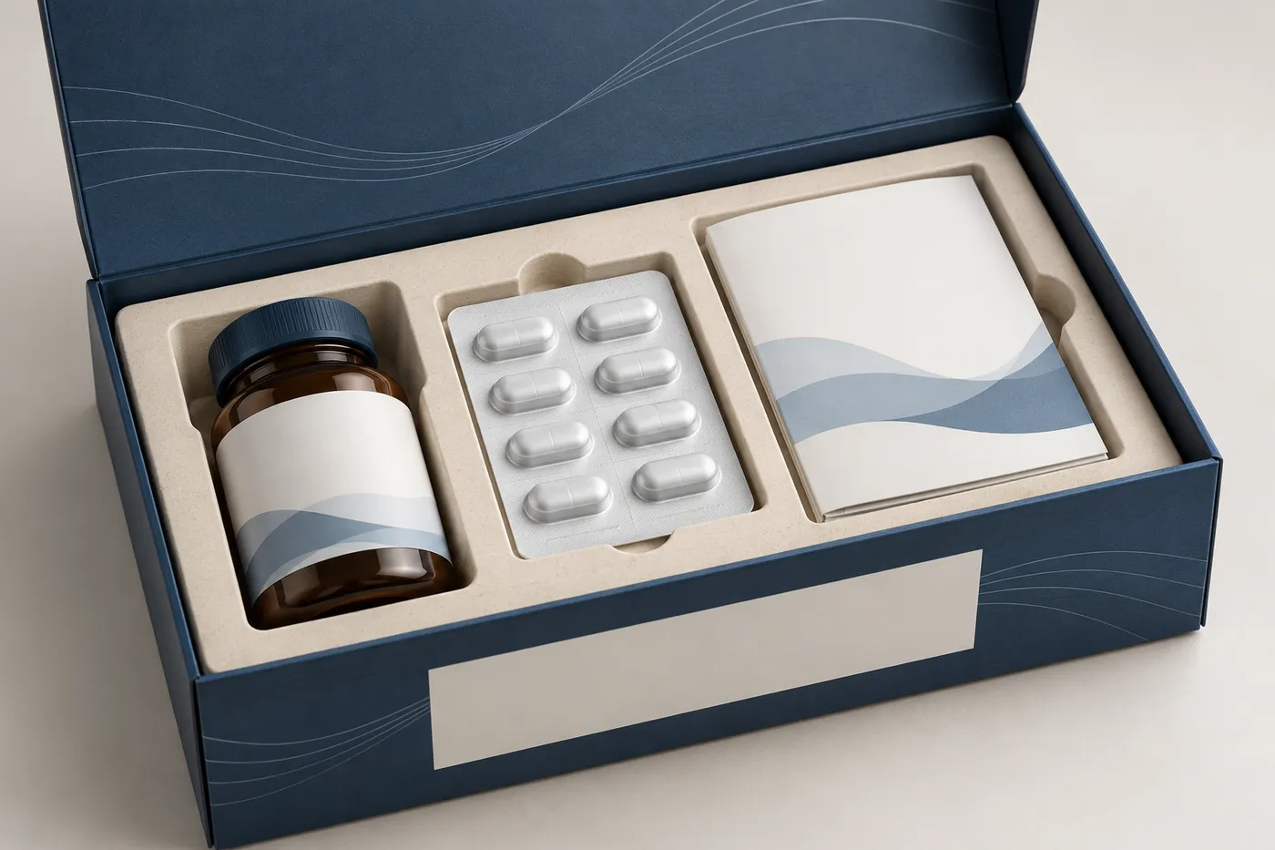 Close view of a clinical trial kit tray separating a bottle, blister wallet, and patient diary.