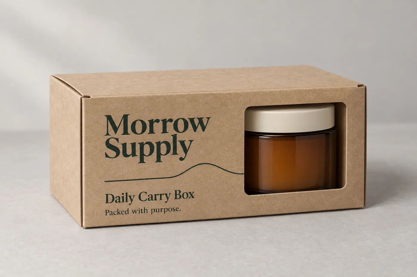 Kraft folding product box with a front window showing a candle jar